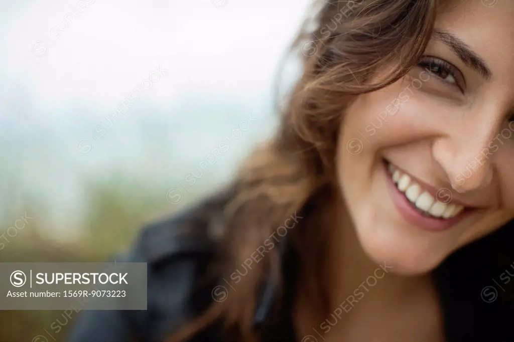 Smiling young woman, cropped