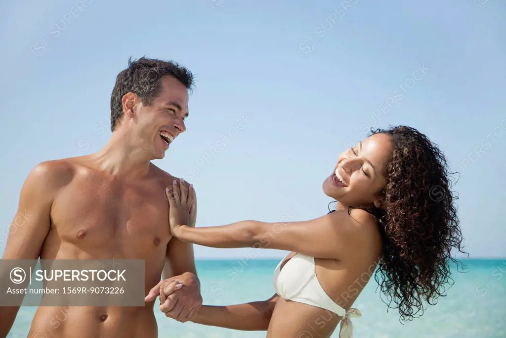 Couple having fun together at the beach