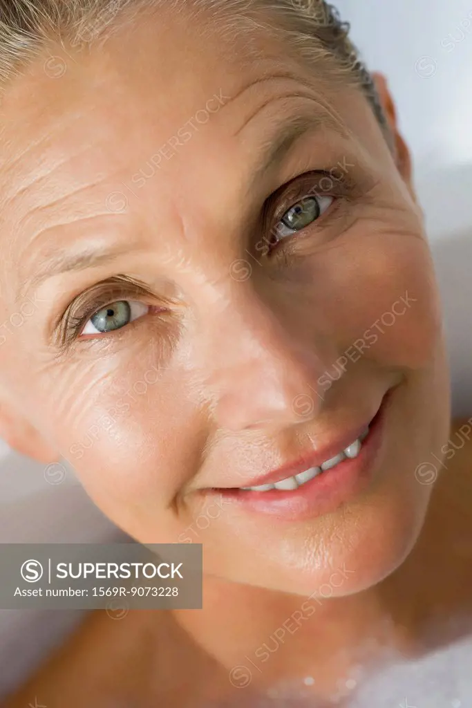 Mature woman in bath, cropped
