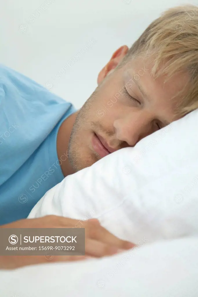 Young man sleeping, cropped