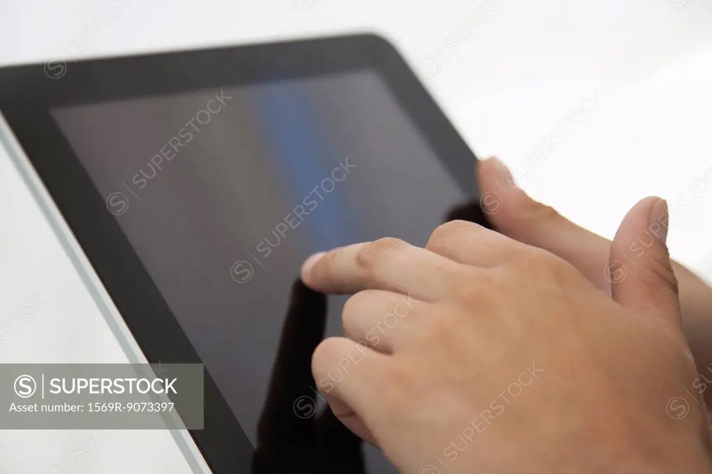 Man using digital tablet, cropped