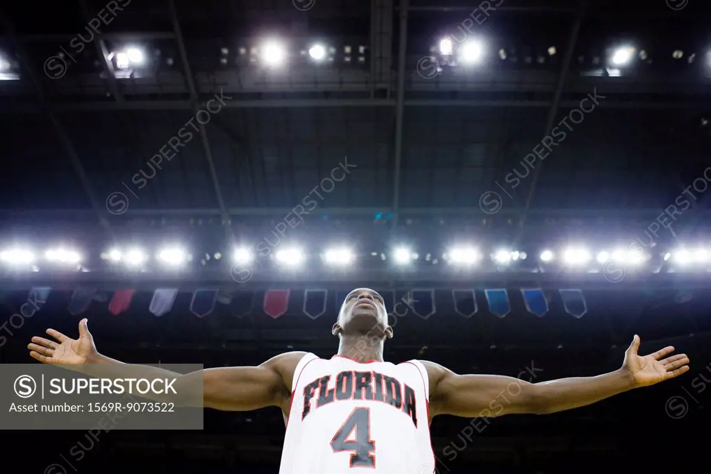 Basketball player with arms outstretched