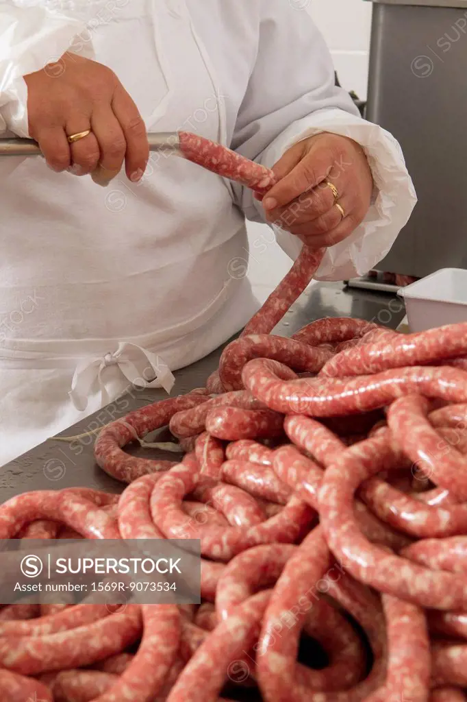 Chef making fresh sausage