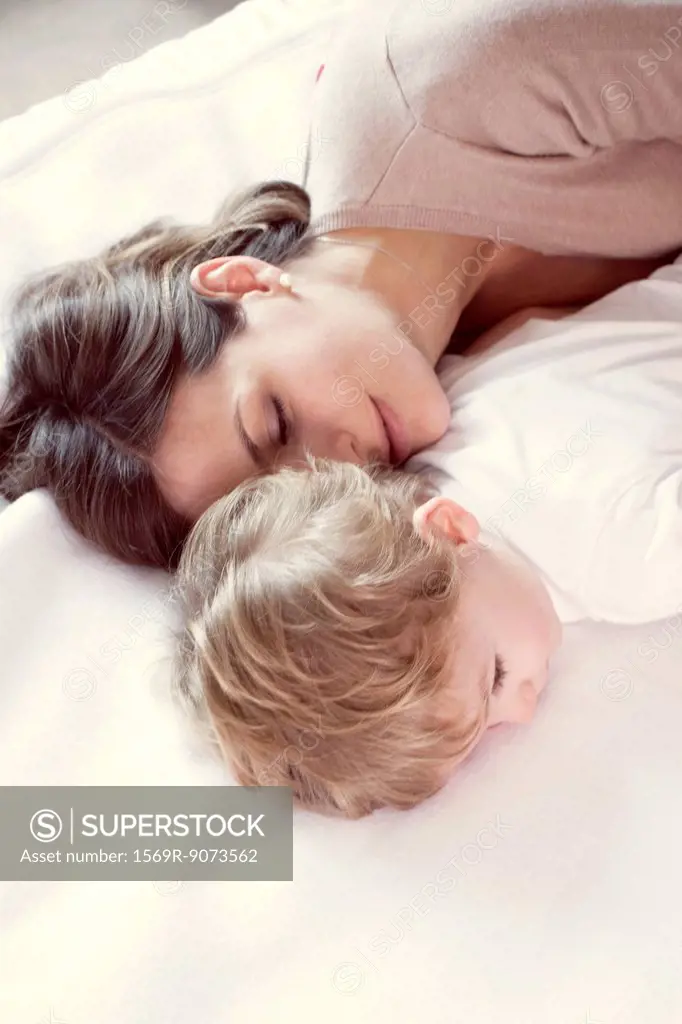 Mother napping with young son