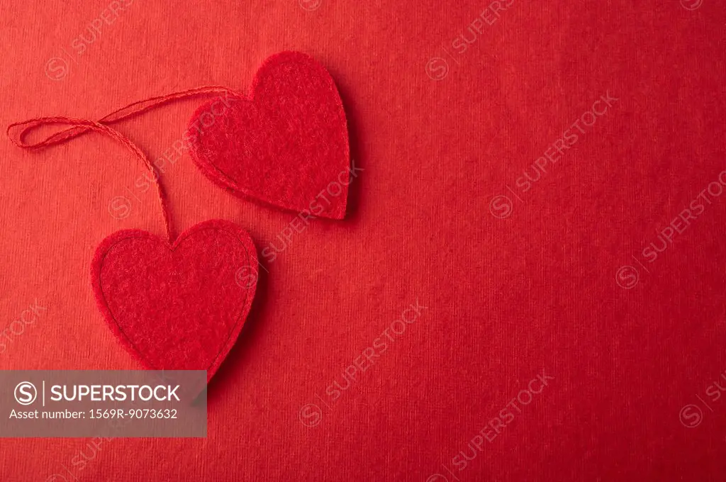 Heart ornaments on red background
