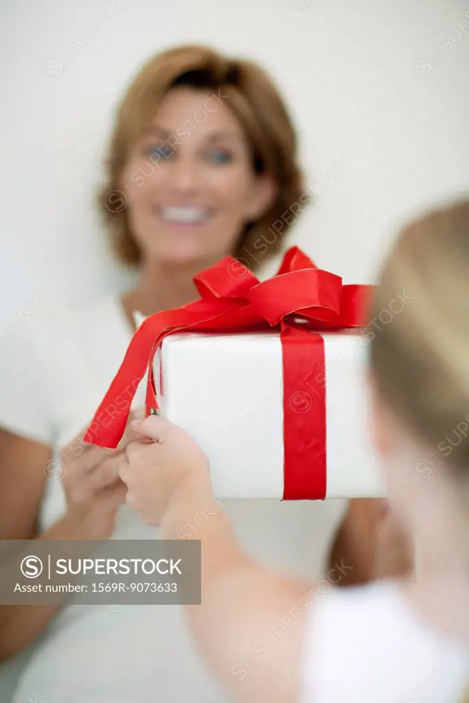 Girl giving mother gift