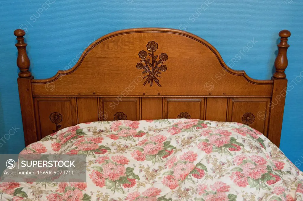 Bed with wooden headboard