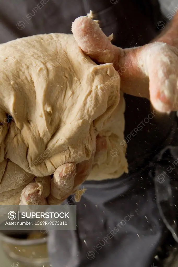 Kneading bread dough, cropped