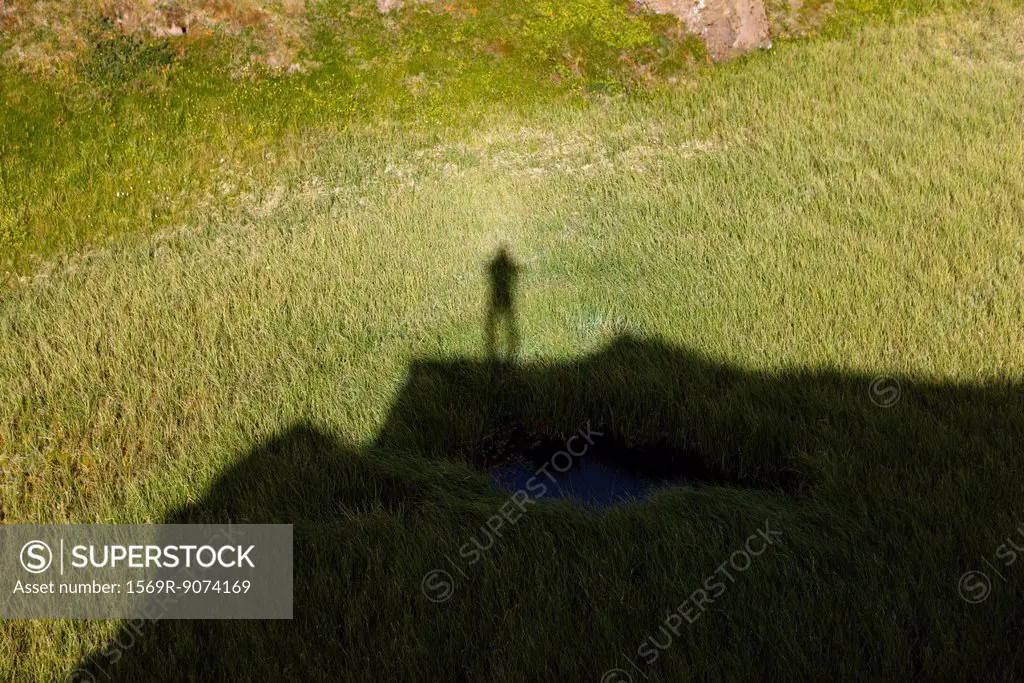 Person´s shadow on grass