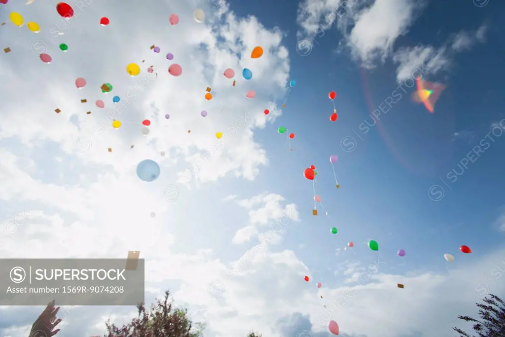 Balloons floating toward sky
