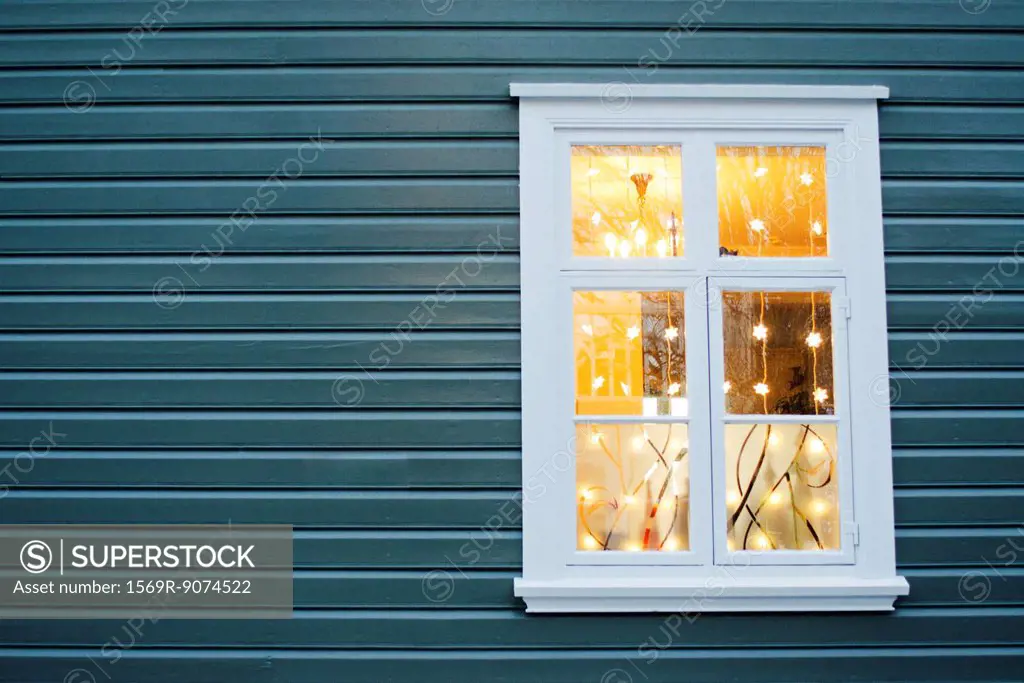 Christmas lights hanging in widow