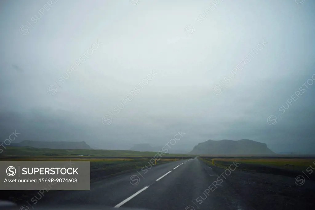 Iceland, road through foggy countryside