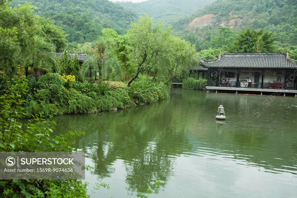 China, tranquil lake scene, restaurant in background