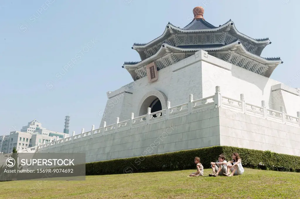 Children sitting on grass by Chiang Kai_shek Memorial Hall, Taipei, Taiwan