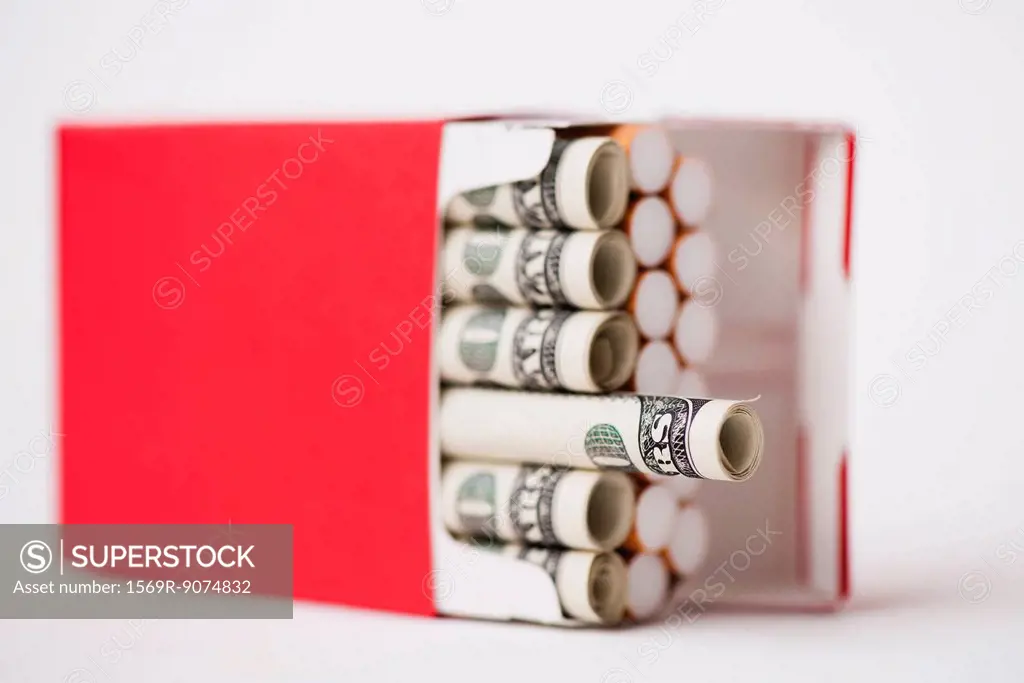 Cigarette pack containing rolled dollars