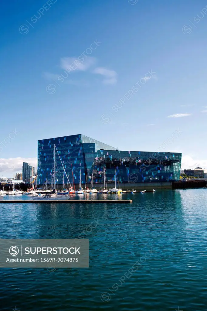 Iceland, Reykjavik, Harpa Concert Hall and marina viewed from harbor