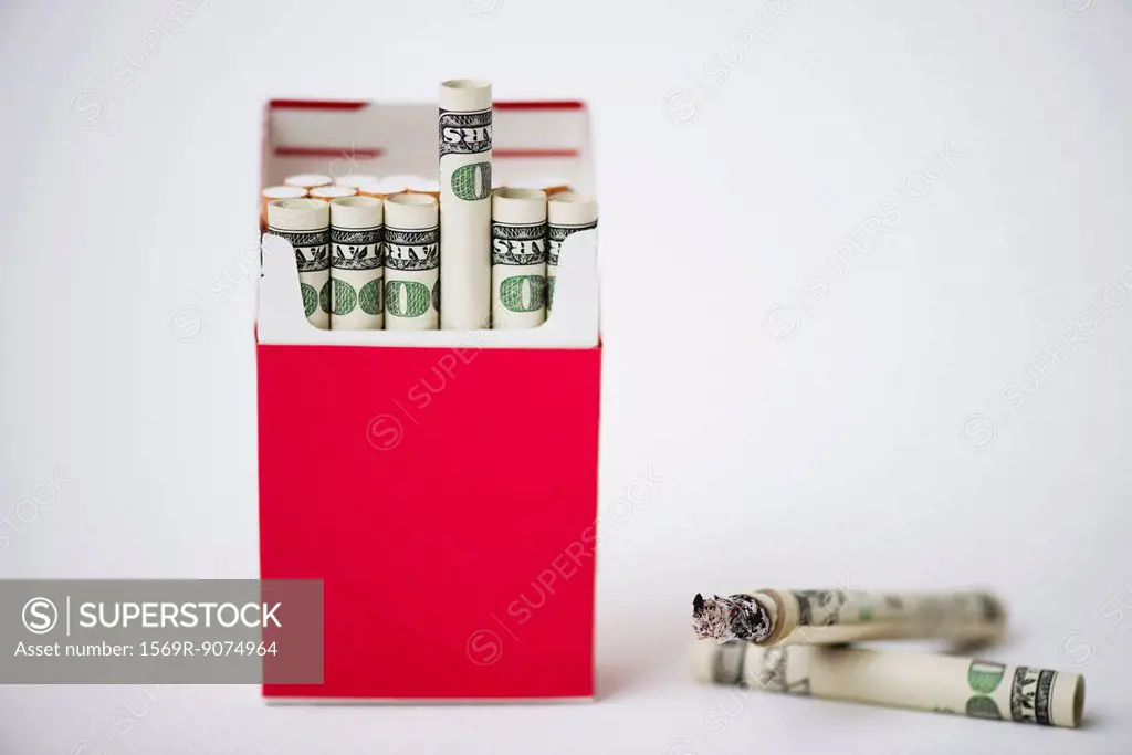 Cigarette pack containing rolled dollars