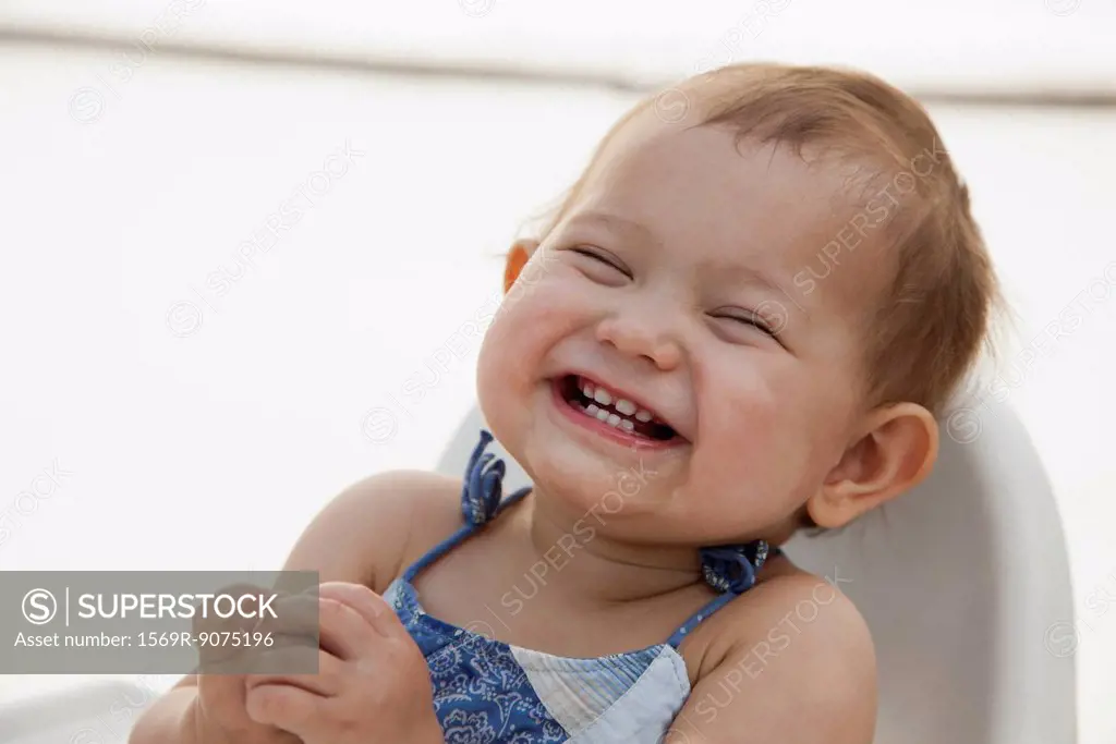 Baby girl laughing, portrait