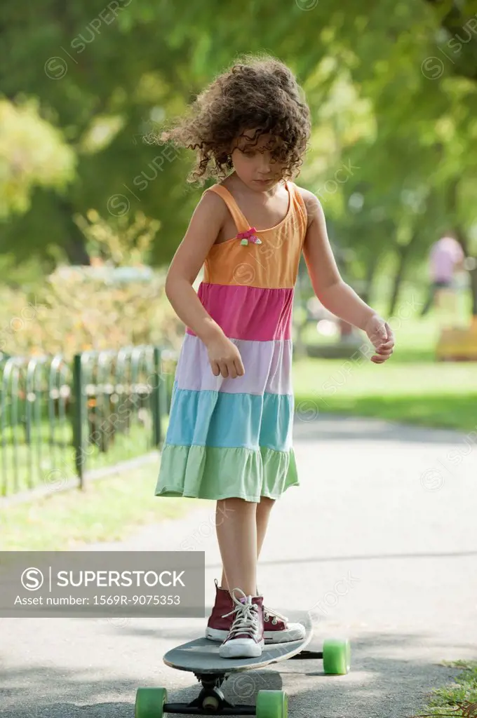 Girl standing on skateboard