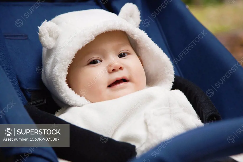 Baby girl wearing bear hood, portrait