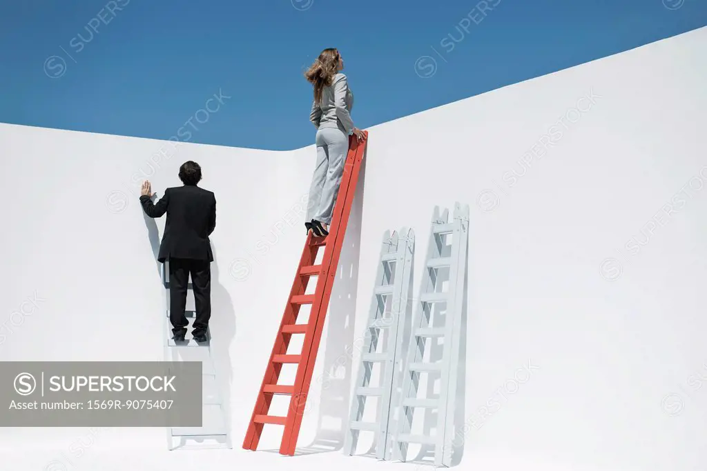 Businesswoman at top of ladder
