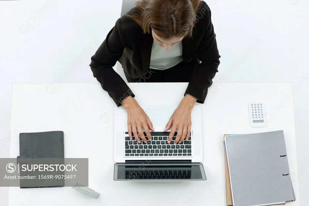 Businesswoman using laptop computer, overhead view