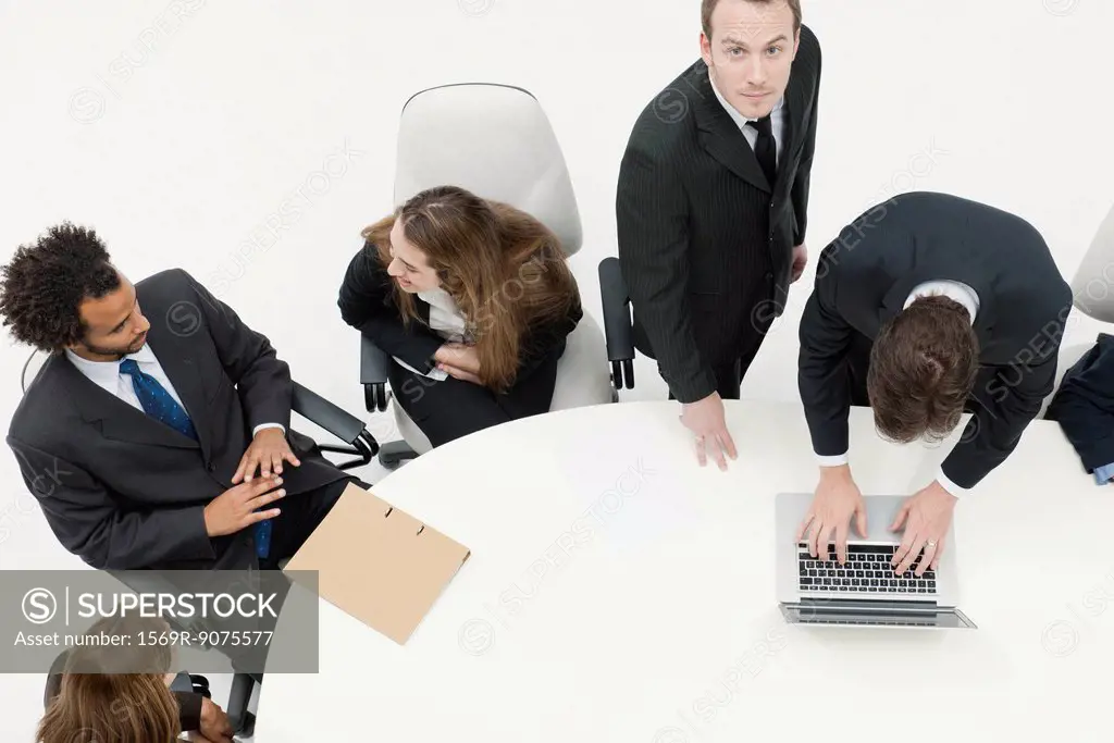 Businessman working with associates at meeting