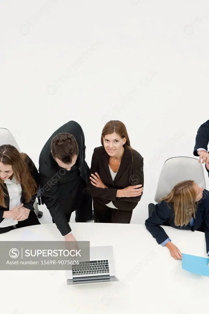 Businesswoman collaborating with colleague in meeting