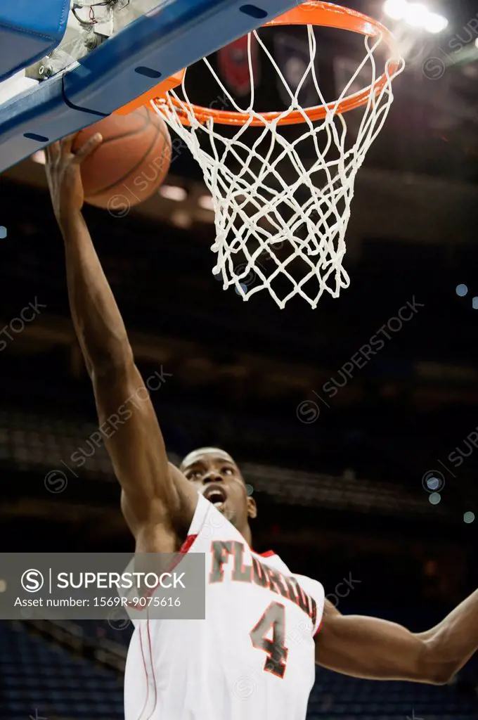 Basketball player making a basket