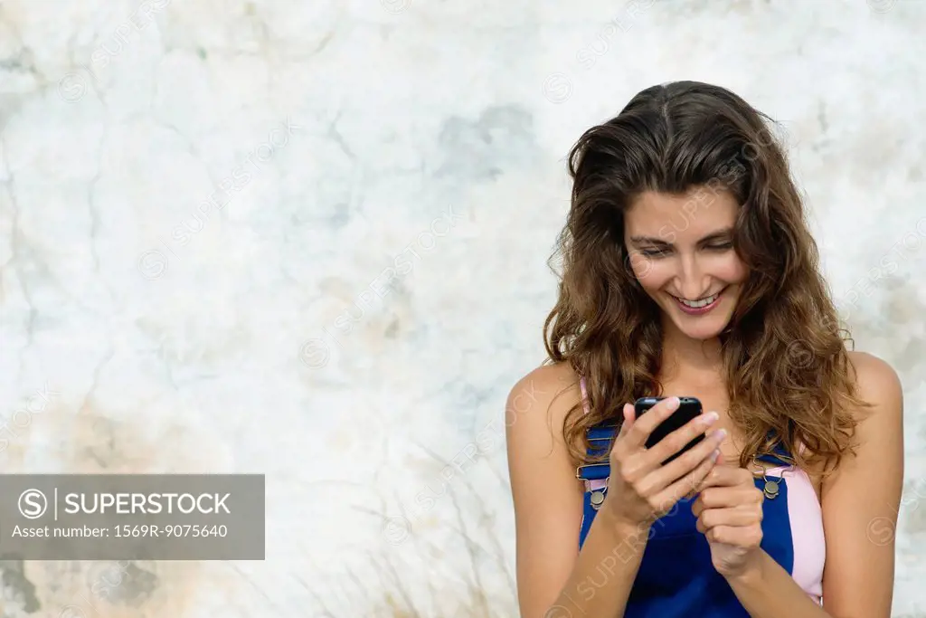 Young woman text messaging