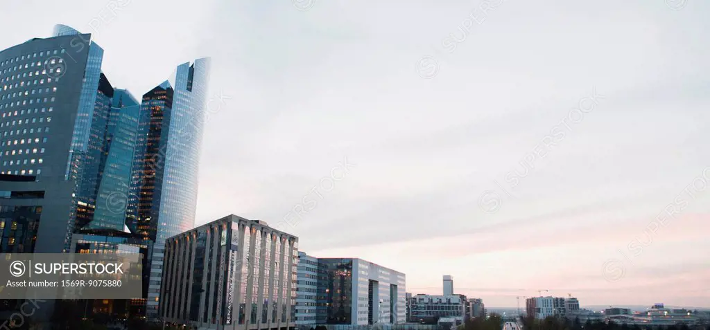 City skyline against pastel_colored sky, panoramic view