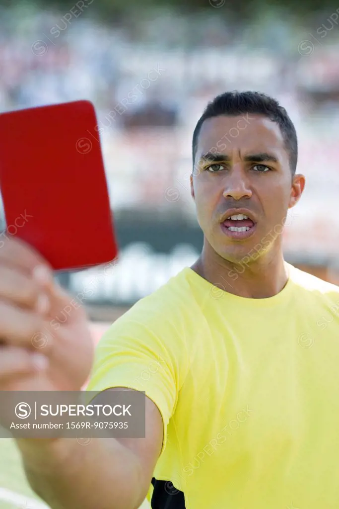 Referee holding red card
