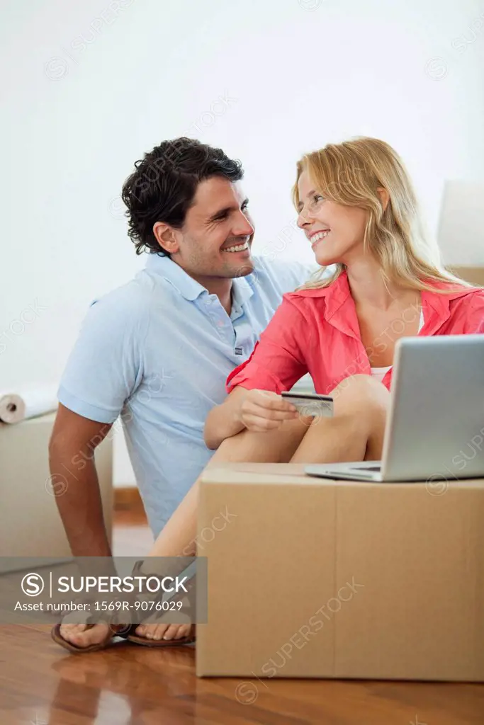 Couple shopping online for their new home
