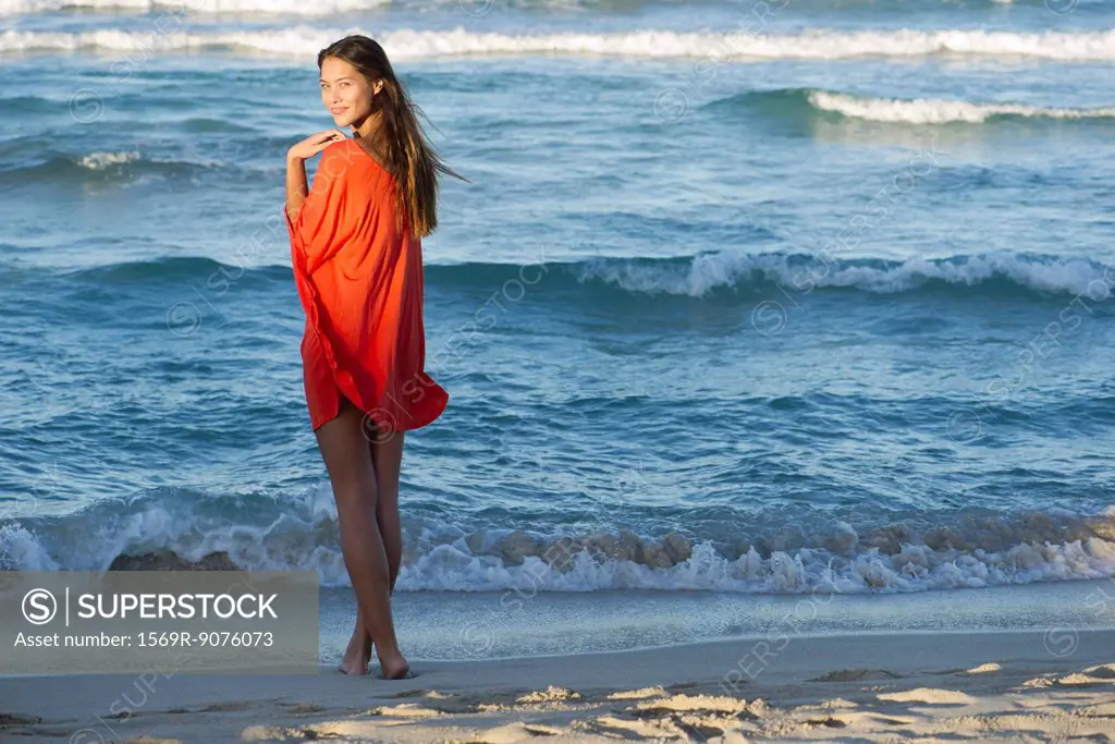 Young woman standing on beach