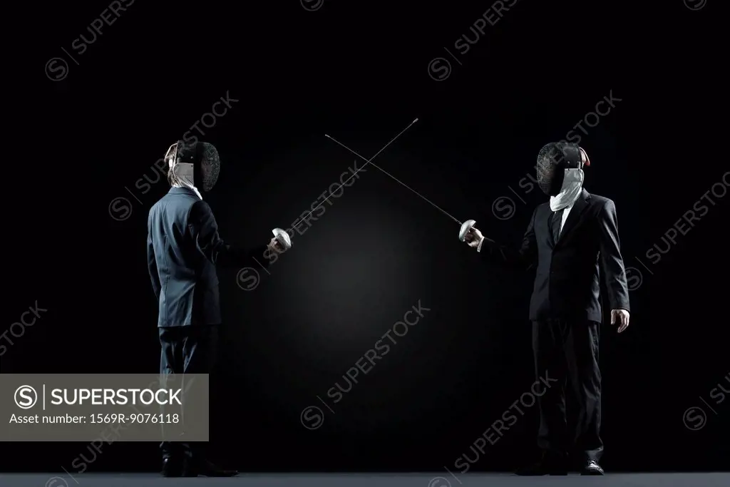 Businessmen at beginning of fencing bout