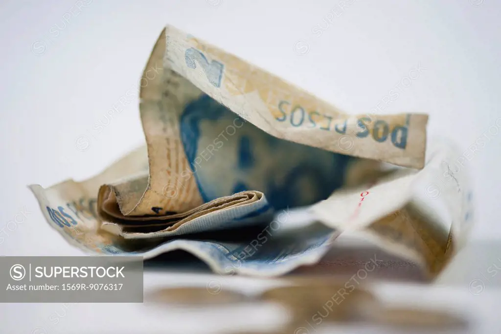 Crumpled Argentine pesos