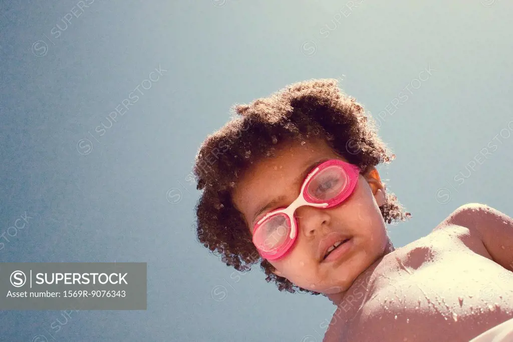 Little girl wearing swim goggles, portrait