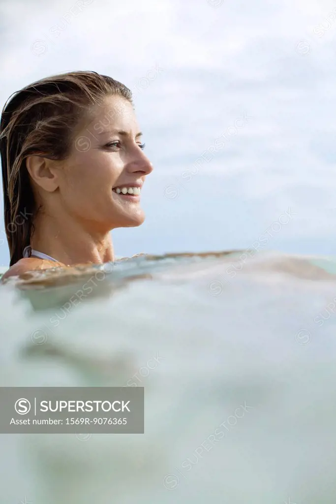 Woman swimming, profile