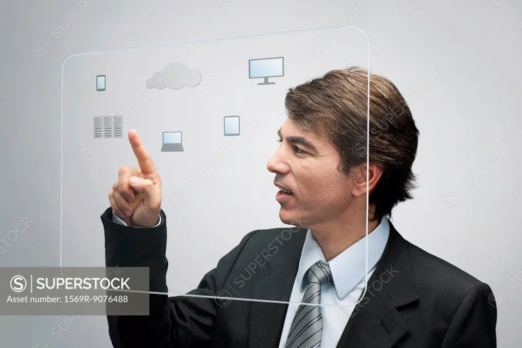 Businessman using cloud computing technology on advanced touch screen interface