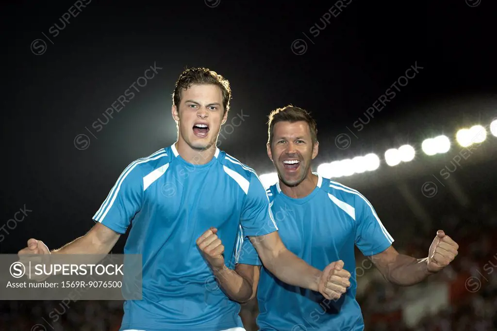 Soccer players cheering, portrait