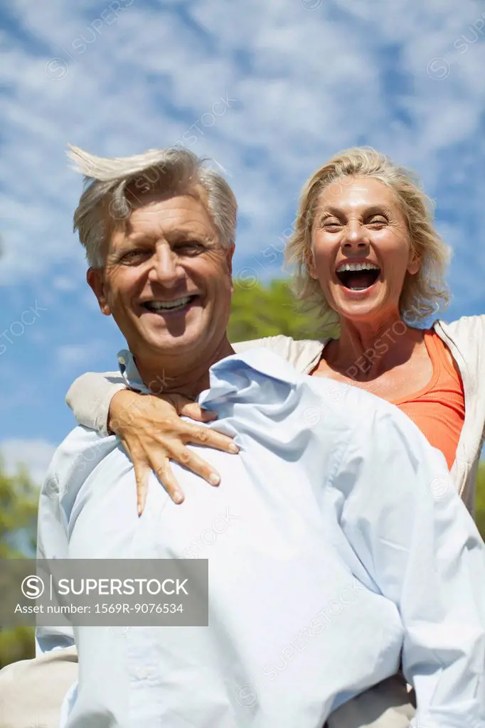 Mature couple together outdoors, portrait