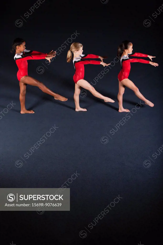 Young girl gymnasts practicing