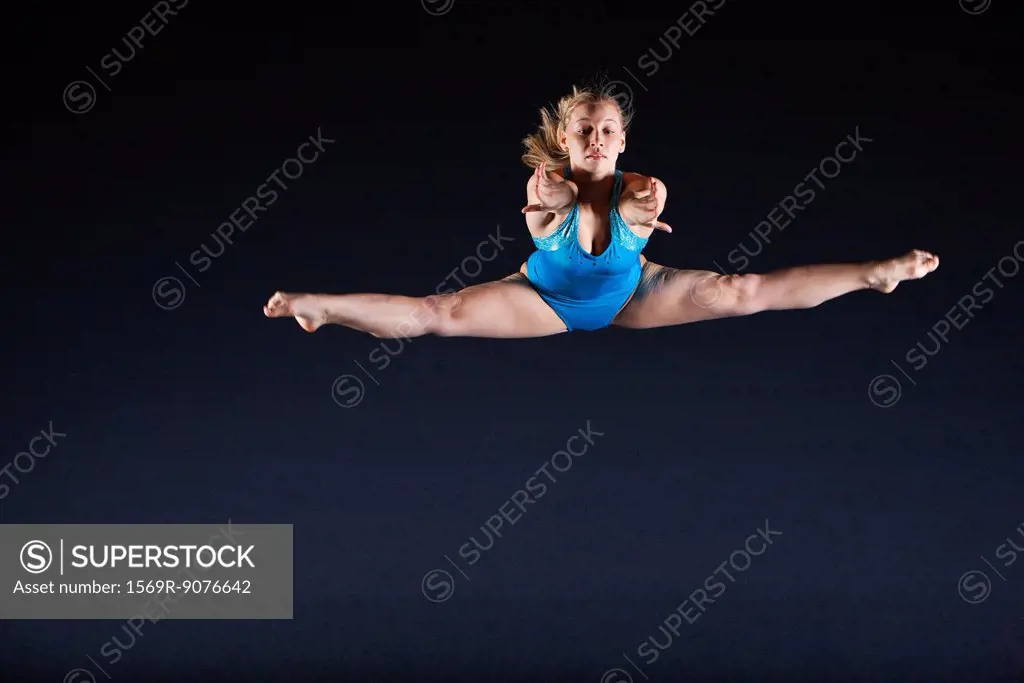 Gymnast jumping in air
