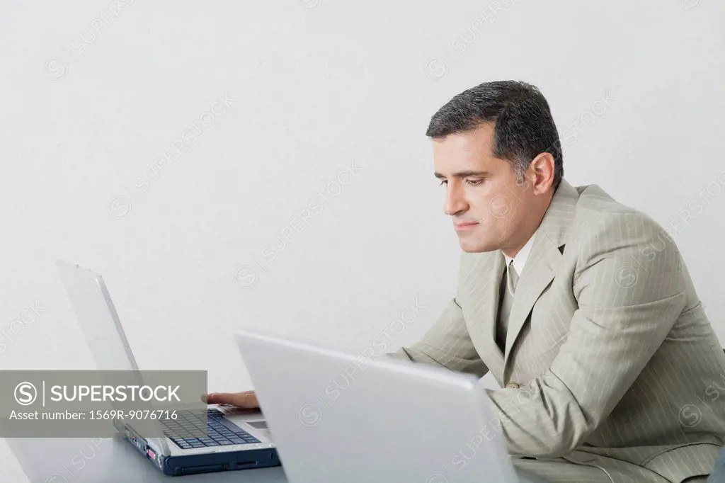 Mature businessman using laptop computer