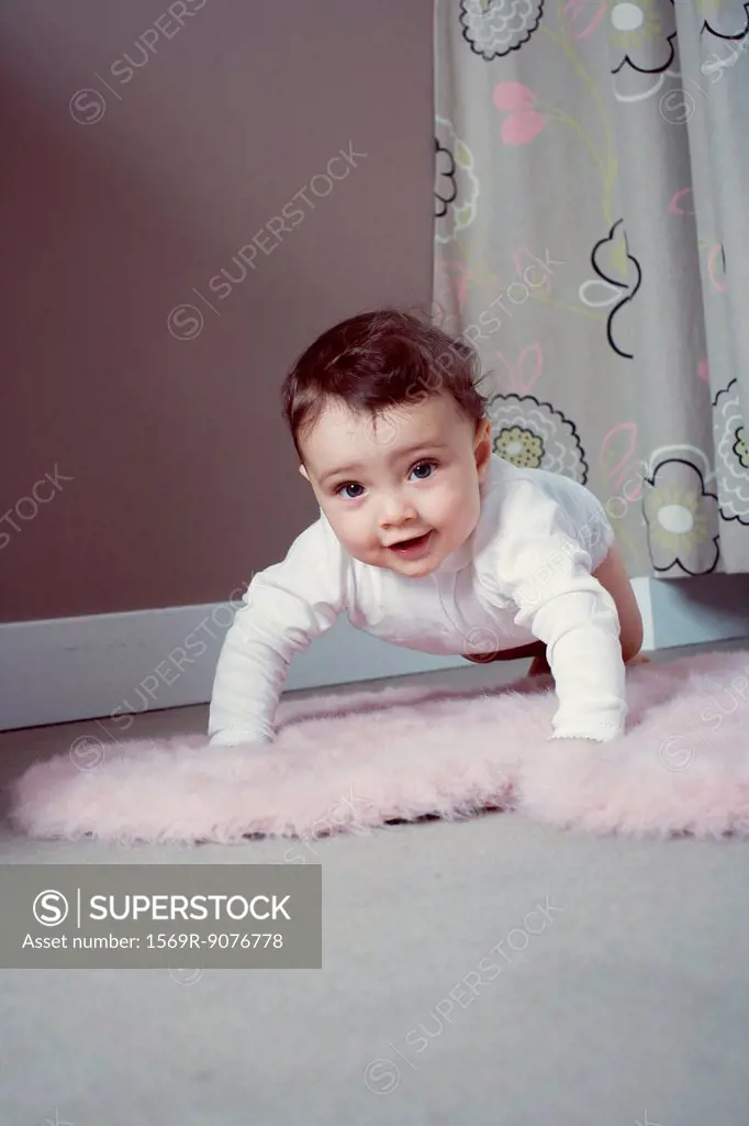 Baby crawling on floor