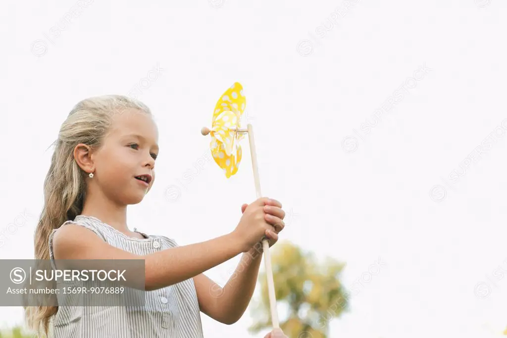 Little girl holding pinwheel