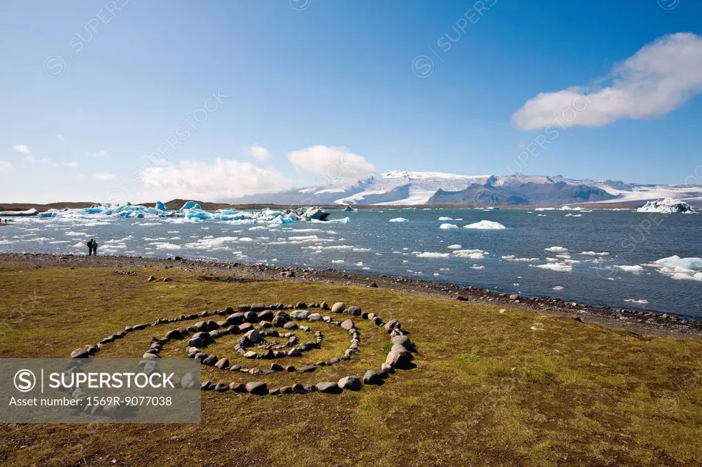 Stones arranged in spiral pattern beside Jokulsarlon glacial lagoon, Iceland