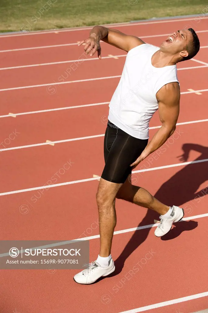 Runner on running track with painful expression