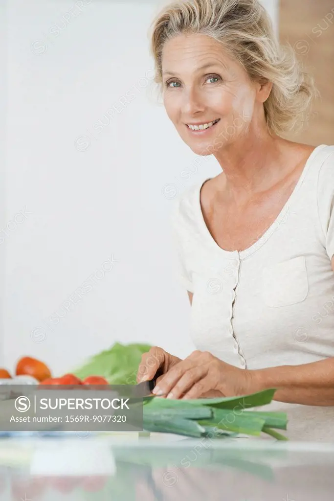 Mature woman preparing healthy food, portrait