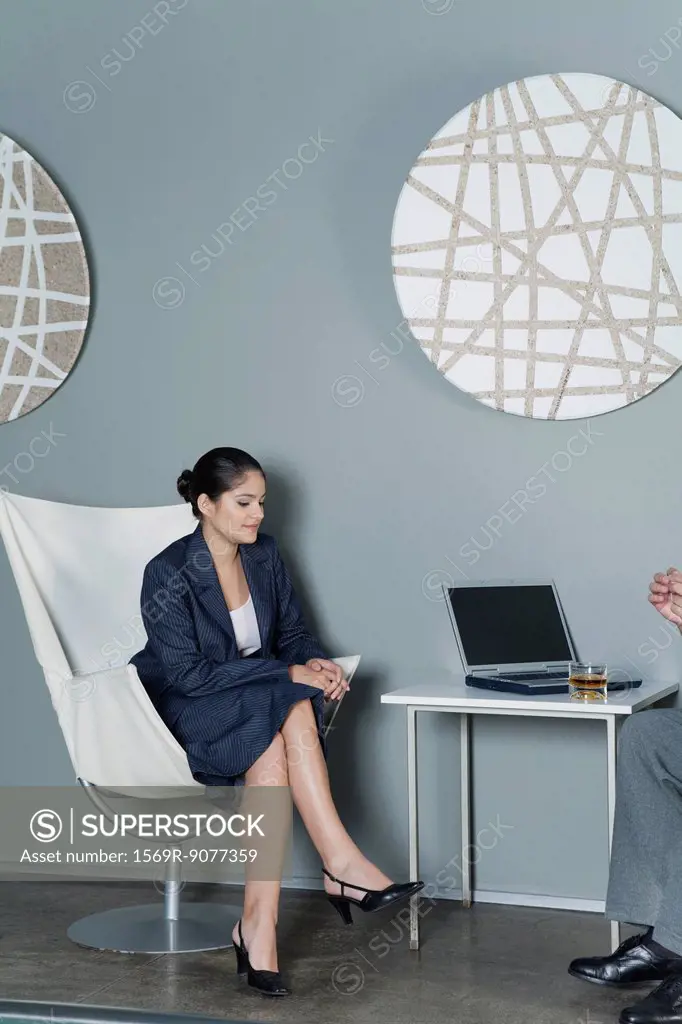 Young businesswoman contemplating during meeting